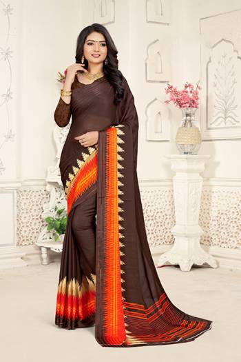 Add Some Casuals With This Rich And Elegant Looking Saree In Brown Color Paired With Brown Colored Blouse. This Saree And Blouse are Fabricated On Georgette Beautified With Minimal Prints. Also It Is Light Weight And Easy To Carry All Day Long. 