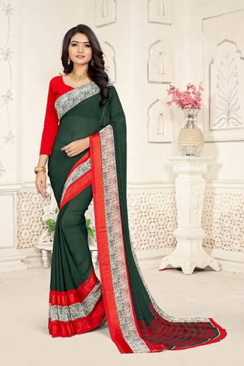 Add Some Casuals With This Rich And Elegant Looking Saree In Dark Green Color Paired With Red Colored Blouse. This Saree And Blouse are Fabricated On Georgette Beautified With Minimal Prints. Also It Is Light Weight And Easy To Carry All Day Long. 