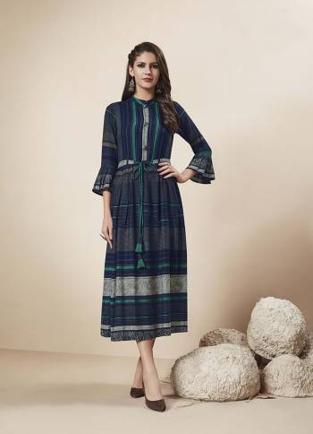 Enhance Your Personality In This Designer Readymade Kurti In Navy Blue Color Fabricated On Rayon. This Kurti Is Light In Weight And Easy To Carry All Day Long. 