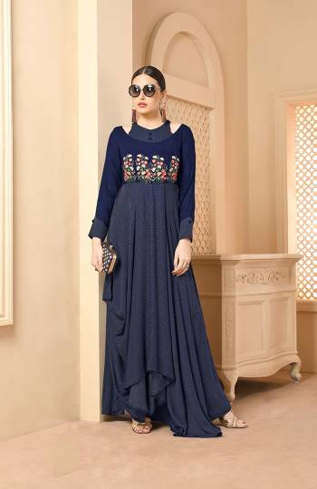 Here Is A Very Beautiful Patterned Designer Readymade Long Kurti In Navy Blue Color Fabricated On Rayon. This Long Kurti Is Light In Weight And Soft Towards Skin Which Is Easy To Carry All Day Long. 