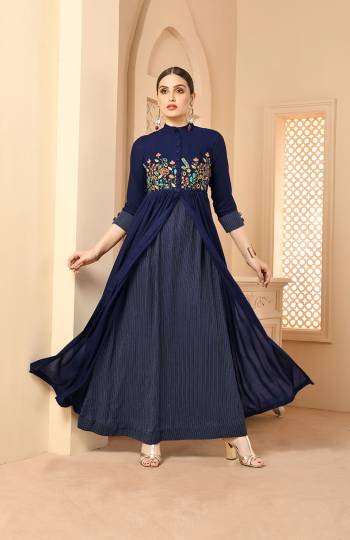 Here Is A Very Beautiful Patterned Designer Readymade Long Kurti In Navy Blue Color Fabricated On Rayon. This Long Kurti Is Light In Weight And Soft Towards Skin Which Is Easy To Carry All Day Long. 