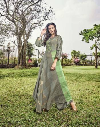 Simple And Elegant Looking Designer Readymade Kurti Is Here In Grey Color Fabricated on Modal Jacquard. This Kurti Is In Light Low Pattern With Prints And Thread Work. 