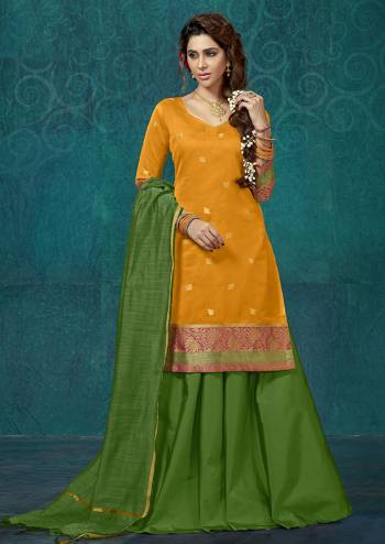 For A Proper Traditional Look, Grab This Readymade Suit In Orange Colored Top Paired With Contrasting Green Colored Bottom And Dupatta. Its Top Is Fabricated On Jacquard Silk Paired With Tafeta Silk Lehenga And Chanderi Silk Dupatta. 