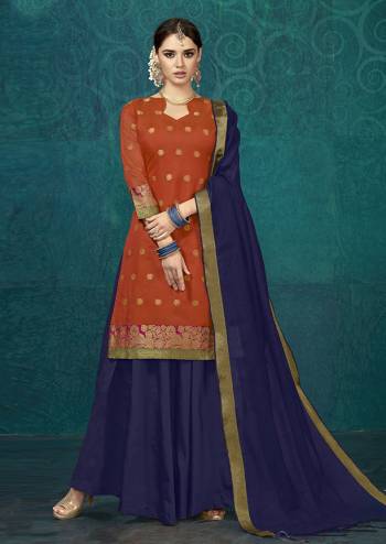 New Shade Is Here To Add Into Your Wardrobe With This Designer Lehenga Suit In Orange Colored Top Paired With Navy Blue Colored Bottom And Dupatta. Its Weaved Top Is Fabricated On Jacquard Silk Paired With Tafeta Silk Lehenga And Chanderi Silk Dupatta. Buy This Readymade Lehenga Suit Now.