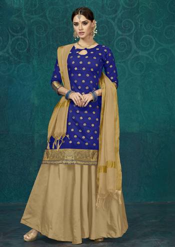 Celebrate This Festive Season With Beauty And Comfort Wearing This Designer Readymade Lehenga Suit In Royal Blue Colored Top Paired With Beige Colored Bottom And Dupatta. It Top Is Fabricated On Jacquard Silk Paired With Tafeta Silk Lehenga And Chanderi Silk Dupatta. This Silk Based Suit Gives A Rich Look To Your Personality. 