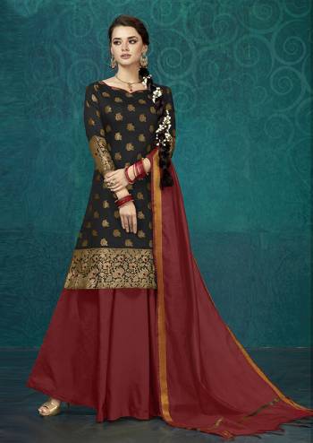 For A Proper Traditional Look, Grab This Readymade Suit In Black Colored Top Paired With Maroon Colored Bottom And Dupatta. Its Top Is Fabricated On Jacquard Silk Paired With Tafeta Silk Lehenga And Chanderi Silk Dupatta. 