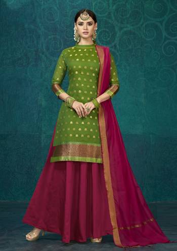 Here Is A Rich And Elegant Looking Designer Readymade Lehenga Suit Is Here In Green Color Paired With Dark Pink Colored Bottom And Dupatta. Its Top IS Fabricated On Jacquard Silk Paired With Tafeta Silk Lehenga And Chanderi Silk Dupatta. Buy This Suit Now.