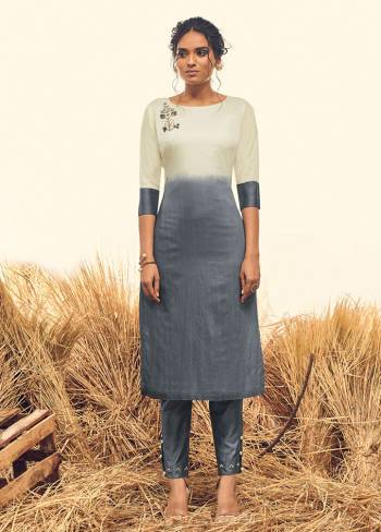 Here Is A Very Beautiful Shaded Kurti In Dark Grey And White Color Paired With Dark Grey Colored Pants. This Top And Bottom Are Fabricated Banarasi Viscose Silk Which Also Gives A Rich Look To Your Personality. 