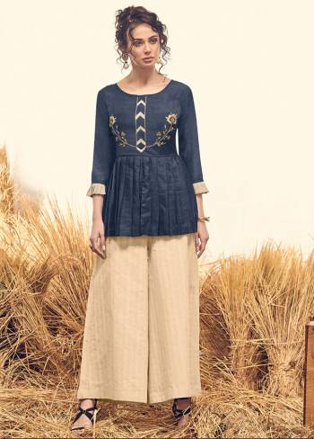 For The Latest Trend And Style, Grab This Readymade Indo-Western Pair In Navy Blue Colored Top Paired With Cream Colored Bottom, Its Top Is Fabricated On Viscose Silk And Bottom IS Khadi Cotton Based, Which Ensures Superb Comfort All Day Long. 