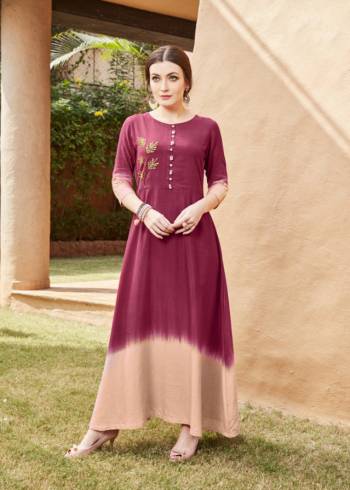 For Your Semi-Casuals Or Social Gatherings, Grab This Designer Readymade Kurti In Maroon & Beige Color. It Has Pretty Attractive Hand Work Which Gives A Rich And Elegant Look Over All. Buy Now.