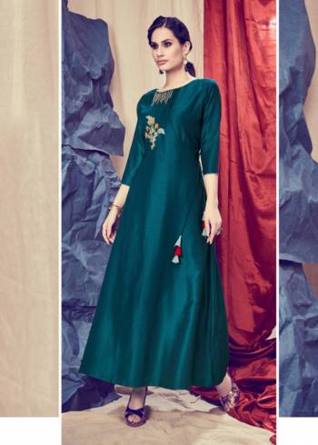 Add This Pretty Readymade Kurti To your Wardrobe In Dark Teal Blue Color. It Is Beautified With Unique Pattern And Attractive Embroidery Which Will Earn You Lots Of Compliments From Onlookers. 