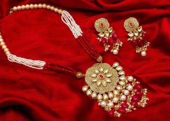 Give An Enhanced Look To Your Personality By Pairing Up This Beautiful Necklace Set With Your Ethnic Attire. This Pretty Set Is In Golden Color Beautified With Stone And Pearl Work. Buy Now.