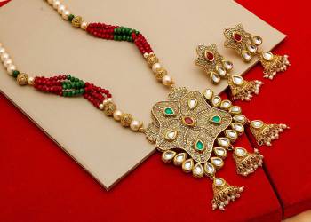 Give An Enhanced Look To Your Personality By Pairing Up This Beautiful Necklace Set With Your Ethnic Attire. This Pretty Set Is In Golden Color Beautified With Stone And Pearl Work. Buy Now.