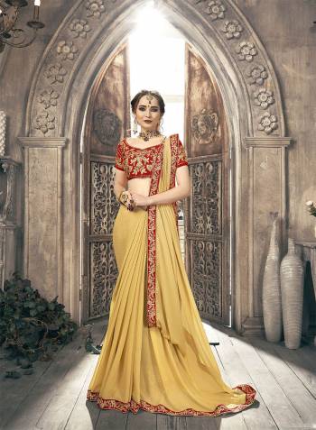 Simple And Elegant Looking Designer Saree Is Here In Plain Light Yellow Color With Embroidered Lace Border Paired With heavy Embroidered Blouse In Red Color. This Saree Is Chiffon Based Paired With Art Silk Fabricated Blouse. 