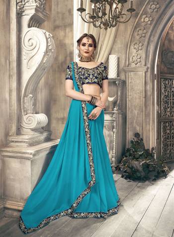 Simple And Elegant Looking Designer Saree Is Here In Plain Blue Color With Embroidered Lace Border Paired With heavy Embroidered Blouse In Navy Blue Color. This Saree Is Chiffon Based Paired With Art Silk Fabricated Blouse. 