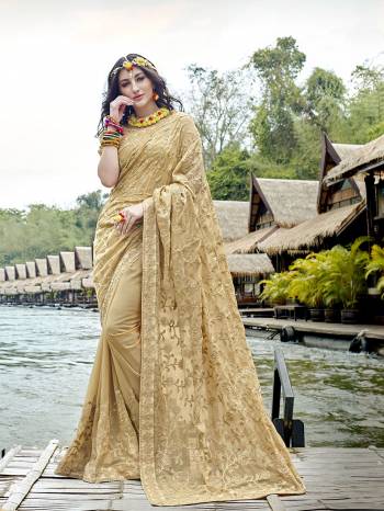 Here Is A Very Beautiful Heavy Designer Saree In Beige Color Paired With Beige Colored Blouse. This Saree And Blouse Are Fabricated On Georgette Beautified With Heavy Tone To Tone Embroidery. 