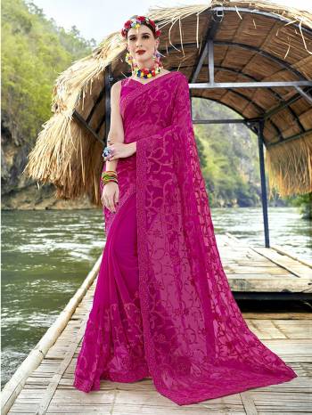 Here Is A Very Beautiful Heavy Designer Saree In Rani Pink Color Paired With Rani Pink Colored Blouse. This Saree And Blouse Are Fabricated On Georgette Beautified With Heavy Tone To Tone Embroidery. 