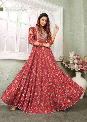 This Festive Season, Grab This Beautiful Designer Readymade Gown In Red Color Fabricated On Muslin. This Gown Is Beautified With Prints All Over And It Is Available In All Regular Sizes. 