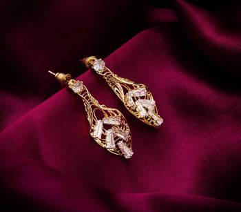 Here Is A Very Pretty Pair Of Simple And Elegant Looking Earring Set In Golden color. It Has Pretty Unique pattern With Attractive Diamond Work. You can Pair This Even With Simple Attire As Well As A Heavy One. This Pretty Evergreen Design Compliments Any Kind Of Attire You Wear. 