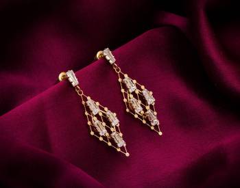 Here Is A Very Pretty Pair Of Simple And Elegant Looking Earring Set In Golden color. It Has Pretty Unique pattern With Attractive Diamond Work. You can Pair This Even With Simple Attire As Well As A Heavy One. This Pretty Evergreen Design Compliments Any Kind Of Attire You Wear. 