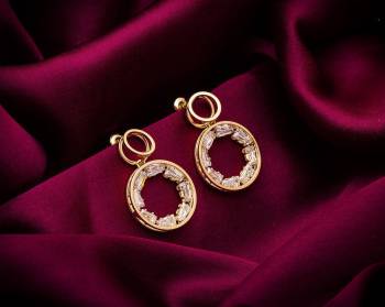 Here Is A Very Pretty Pair Of Simple And Elegant Looking Earring Set In Golden color. It Has Pretty Unique pattern With Attractive Diamond Work. You can Pair This Even With Simple Attire As Well As A Heavy One. This Pretty Evergreen Design Compliments Any Kind Of Attire You Wear. 