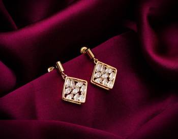 Here Is A Very Pretty Pair Of Simple And Elegant Looking Earring Set In Golden color. It Has Pretty Unique pattern With Attractive Diamond Work. You can Pair This Even With Simple Attire As Well As A Heavy One. This Pretty Evergreen Design Compliments Any Kind Of Attire You Wear. 