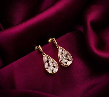 Here Is A Very Pretty Pair Of Simple And Elegant Looking Earring Set In Golden color. It Has Pretty Unique pattern With Attractive Diamond Work. You can Pair This Even With Simple Attire As Well As A Heavy One. This Pretty Evergreen Design Compliments Any Kind Of Attire You Wear. 