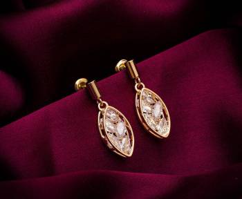 Here Is A Very Pretty Pair Of Simple And Elegant Looking Earring Set In Golden color. It Has Pretty Unique pattern With Attractive Diamond Work. You can Pair This Even With Simple Attire As Well As A Heavy One. This Pretty Evergreen Design Compliments Any Kind Of Attire You Wear. 