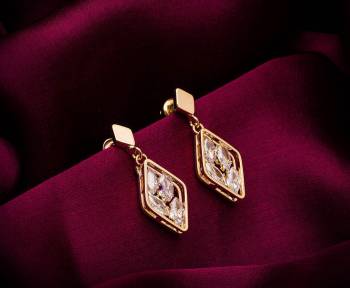 Here Is A Very Pretty Pair Of Simple And Elegant Looking Earring Set In Golden color. It Has Pretty Unique pattern With Attractive Diamond Work. You can Pair This Even With Simple Attire As Well As A Heavy One. This Pretty Evergreen Design Compliments Any Kind Of Attire You Wear. 