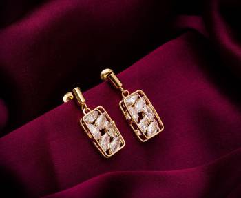 Here Is A Very Pretty Pair Of Simple And Elegant Looking Earring Set In Golden color. It Has Pretty Unique pattern With Attractive Diamond Work. You can Pair This Even With Simple Attire As Well As A Heavy One. This Pretty Evergreen Design Compliments Any Kind Of Attire You Wear. 