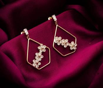 Here Is A Very Pretty Pair Of Simple And Elegant Looking Earring Set In Golden color. It Has Pretty Unique pattern With Attractive Diamond Work. You can Pair This Even With Simple Attire As Well As A Heavy One. This Pretty Evergreen Design Compliments Any Kind Of Attire You Wear. 