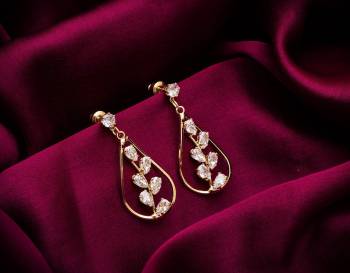 Here Is A Very Pretty Pair Of Simple And Elegant Looking Earring Set In Golden color. It Has Pretty Unique pattern With Attractive Diamond Work. You can Pair This Even With Simple Attire As Well As A Heavy One. This Pretty Evergreen Design Compliments Any Kind Of Attire You Wear. 