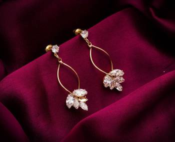 Here Is A Very Pretty Pair Of Simple And Elegant Looking Earring Set In Golden color. It Has Pretty Unique pattern With Attractive Diamond Work. You can Pair This Even With Simple Attire As Well As A Heavy One. This Pretty Evergreen Design Compliments Any Kind Of Attire You Wear. 