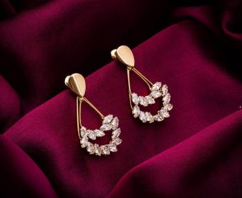 Here Is A Very Pretty Pair Of Simple And Elegant Looking Earring Set In Golden color. It Has Pretty Unique pattern With Attractive Diamond Work. You can Pair This Even With Simple Attire As Well As A Heavy One. This Pretty Evergreen Design Compliments Any Kind Of Attire You Wear. 