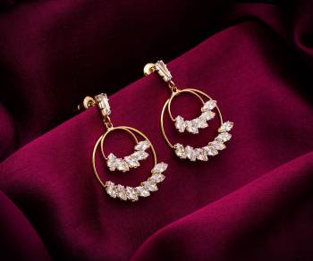 Here Is A Very Pretty Pair Of Simple And Elegant Looking Earring Set In Golden color. It Has Pretty Unique pattern With Attractive Diamond Work. You can Pair This Even With Simple Attire As Well As A Heavy One. This Pretty Evergreen Design Compliments Any Kind Of Attire You Wear. 