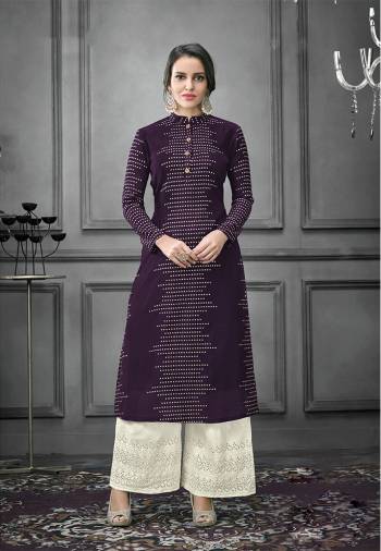 Enhance Your Personality Wearing This Designer Readymade Pair In Kurti And Plazzo. This Pretty Foil Printed Kurti Is In Dark Wine Color Fabricated On Art Silk Paired With Cotton Fabricated Thread Embroidered Bottom. Both The Top And Bottom are Fully Stitched And Available In All Sizes. 