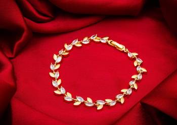 Give An Elegant Look To Your Wrist Wearing This Designer Bracelet?In Golden Color Beautified With Attractive Diamond Work. This Bracelet Can Be Paired With Any Colored And Type Of Attire, Buy Now.