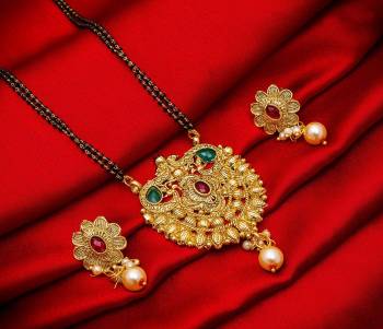 Grab This Heavy Double Chained Magalsutra Set Which Has A Heavy Designer Attatched Pendant With A Pair Of Earrings. This Mangalsutra Can Be Paired With Any Colored Traditional Attire And Suitable For Occasion Wear. Buy Now