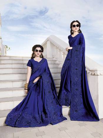 Bright And Visually Appealing Color Is Here With This Heavy Designer Saree In Royal Blue Color Paired With Royal Blue Colored Blouse. This Saree Is Fabricated On Satin Chiffon Paired With Art Silk Fabricated Blouse. It Has Very Pretty Tone To Tone Embroidery Which Earn You Lots Of Compliments From Onlookers. 