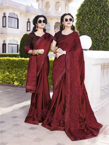 For A Royal Look, Grab This Heavy Designer Saree In Maroon Color Paired With Maroon Colored Blouse. This Saree Is Satin Chiffon Based Paired With Art Silk Fabricated Blouse. It Has Heavy Embroidery With Tone To Tone Thread Work. 