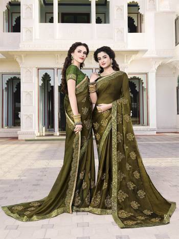 New Shade Is Here To Add Into Your Wardrobe With This Heavy Designer Saree In olive Green Color Paired With Green Colored Blouse. This Heavy Embroidered Saree Is Fabricated On Satin Chiffon Paired With Art Silk Fabricated Blouse. 