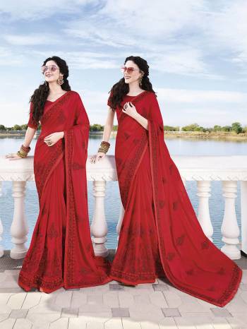 Catch All The Limelight At The Next Wedding You Attend Wearing This Heavy Designer Saree In Red Color Paired With Red Colored Blouse. This Saree Is Fabricated On Satin Chiffon Paired With Art Silk fabricated Blouse. It Is Beautified With Heavy Tone To Tone Embroidery Which Gives A Rich Subtle Look.