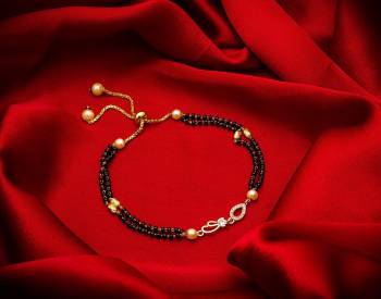 Here Is Very Pretty And Trending Mangalsutra Bracelet In Black And Gold. This Mangalsutra Bracelet Has A Pretty Delicate Design And Pattern Which Gives An Elegant Look To Your Wrist. Buy This Latest Trend Now.