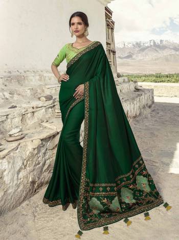 Go With The Pretty Shades Of Green With This Heavy Designer Saree In Dark Green Color Paired with Light Green Colored Blouse. This Saree Is Fabricated on Soft Silk Paired With art Silk Fabricated Blouse. It Is Light Weight And Easy To Carry All Day Long. 