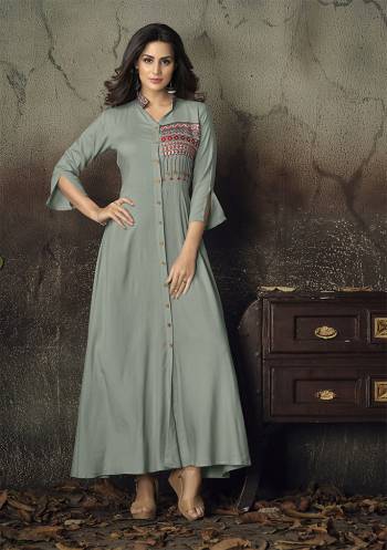 For A Rich And Subtle Look, Grab This Designer Readymade Gown In Grey Color Fabricated On Rayon. It Has Very Beautiful Sleeve Pattern With Embroidery Over The Yoke. 