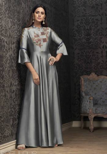 Flaunt Your Rich And Elegant Taste Wearing This Designer Readymade Gown In Grey Color. This Gown IS Fabricated On Satin Silk Which Is Rich In Touch And Durable. It Is Beautified With Attractive Multi Colored Embroidery. 