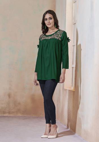 Grab This Very Pretty Readymade Top For Your Semi-Casual, College Or Work Place In Dark Green Color Fabricated On Rayon. Its Fabric Is Soft Towards And Ensures Superb Comfort all Day Long. Also It Is Available In All Regular Size, Choose As Per Your Desired Fit And Comfort. 