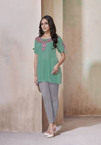 For Your Casual Or Semi-Casuals, Grab This Designer Readymade Top In Sea Green Color Fabricated On Rayon. It Is Beautified Simple Thread Work And Available In All Regular Sizes. 