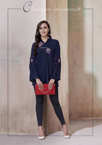 Simple And Elegant Looking Designer Readymade Top Is Here In Navy Blue Color Fabricated On Rayon. It Is Beautified With Multi Colored Thread Work And Available In All Regular Sizes. 