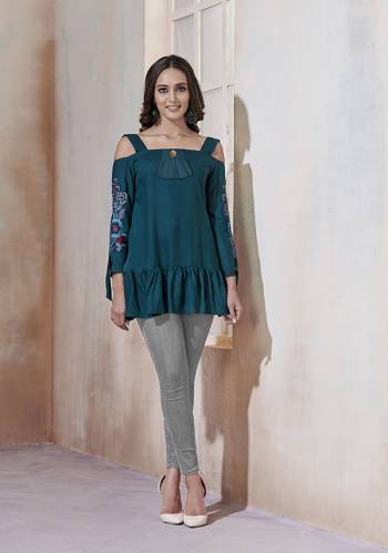 For Your Casual Or Semi-Casuals, Grab This Designer Readymade Top In Prussian Blue Color Fabricated On Rayon. It Is Beautified Simple Thread Work And Available In All Regular Sizes. 